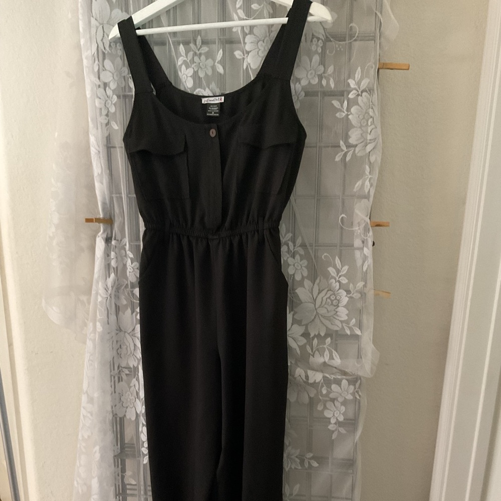 Luna  Jumpsuit NWOT. Pockets in the front and Jeanie legs.